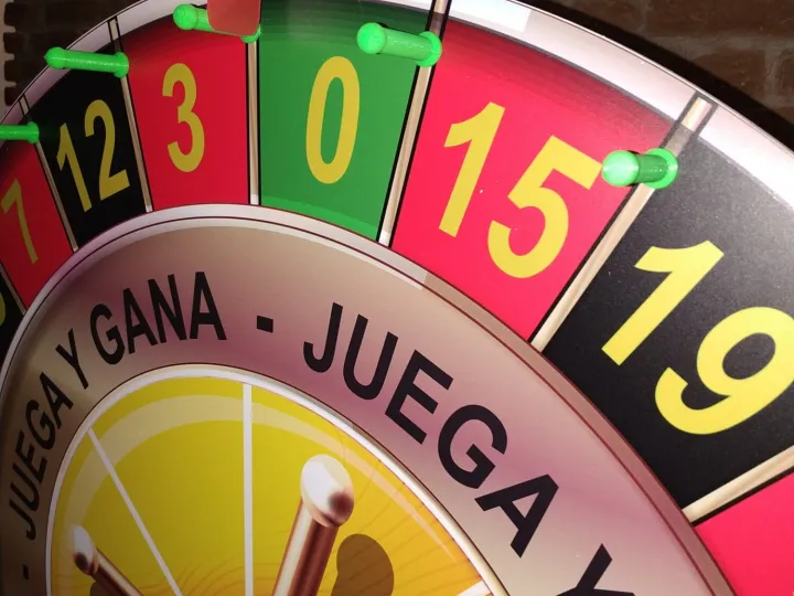 Close-up of a small "play and win" numbered wheel
