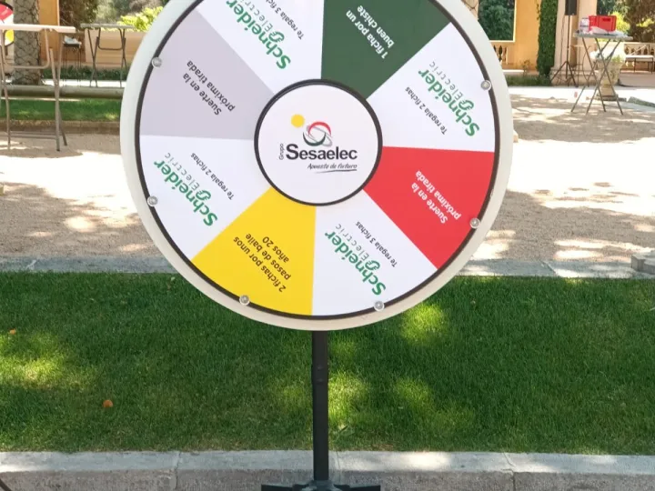 White, red and green prize wheel in a garden