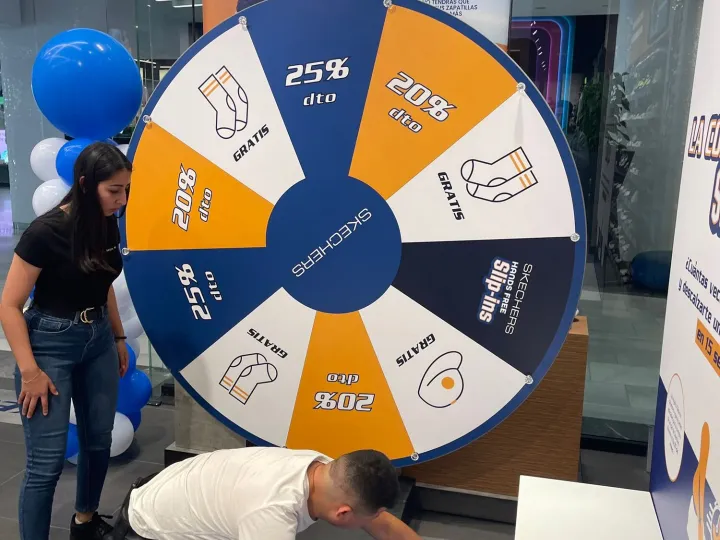 Setting up a giant prize wheel in a shoe shop