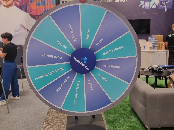 Turquoise giant prize wheel at a digital marketing fair