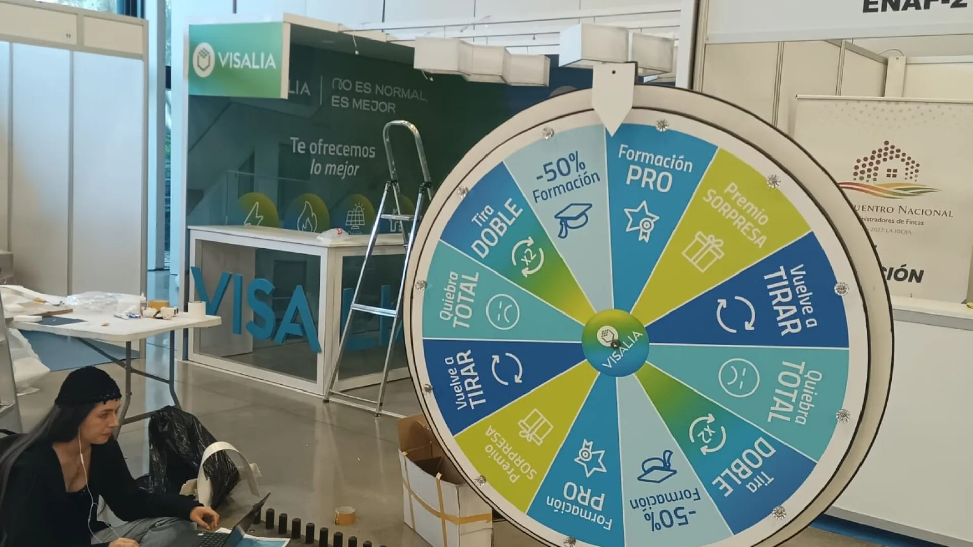 Setting up a promotional wheel in an exhibition hall