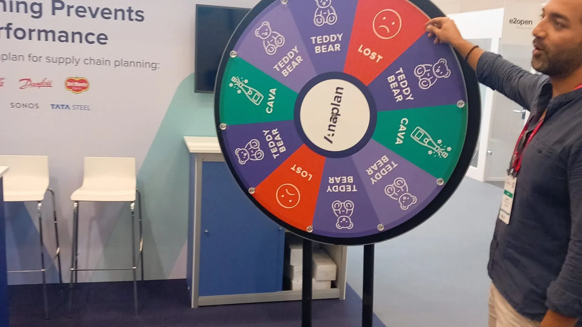 Visitor spinning a prize wheel at a trade show