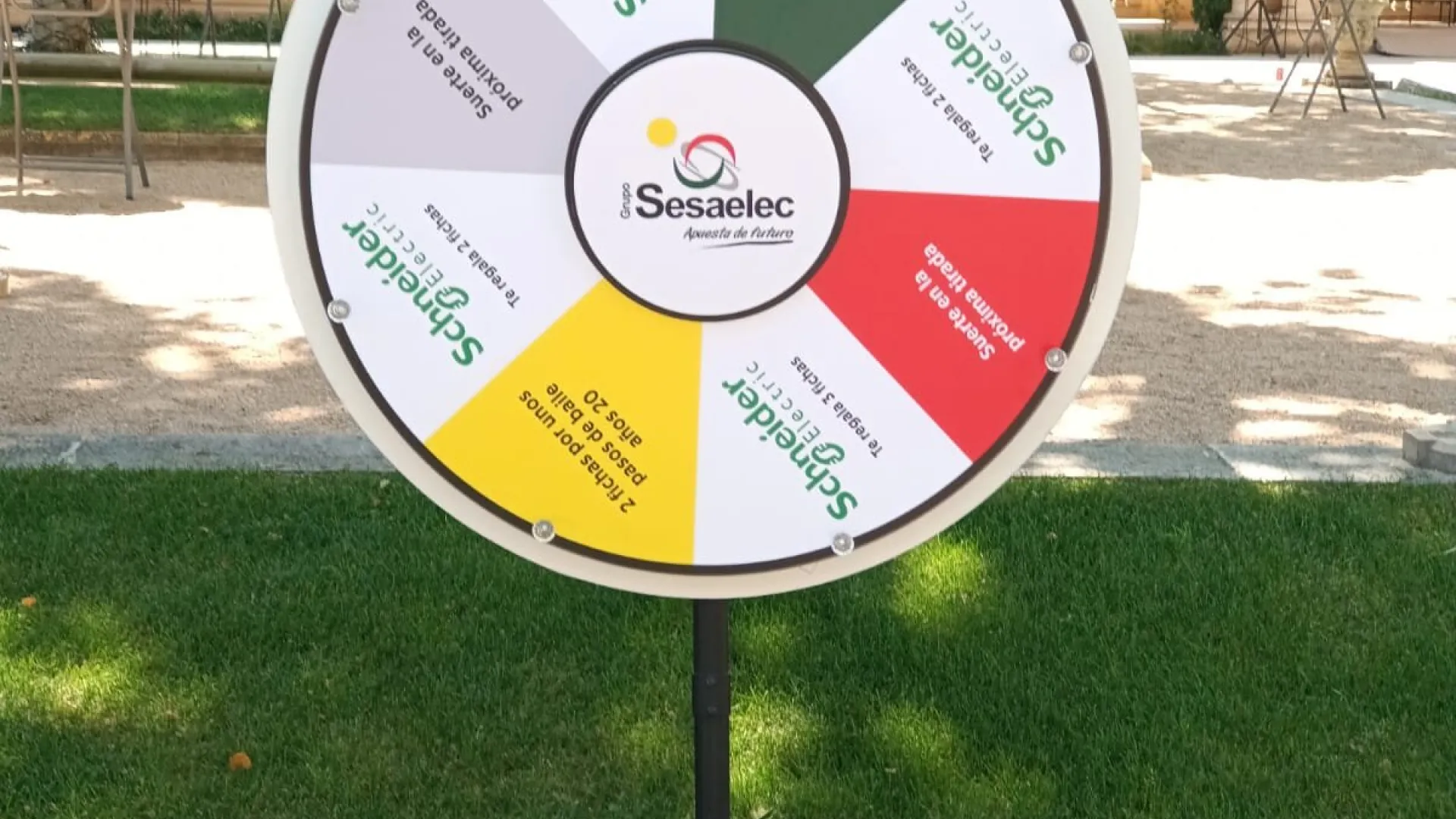 White, red and green prize wheel in a garden