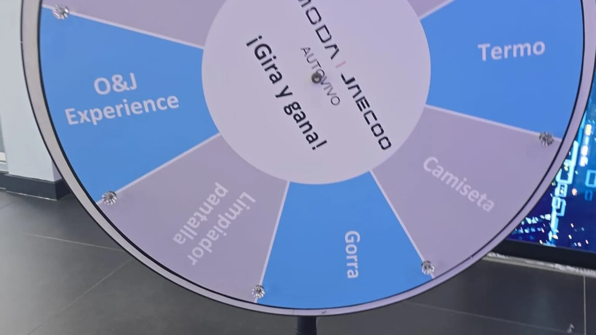 Blue promotional wheel on a stand