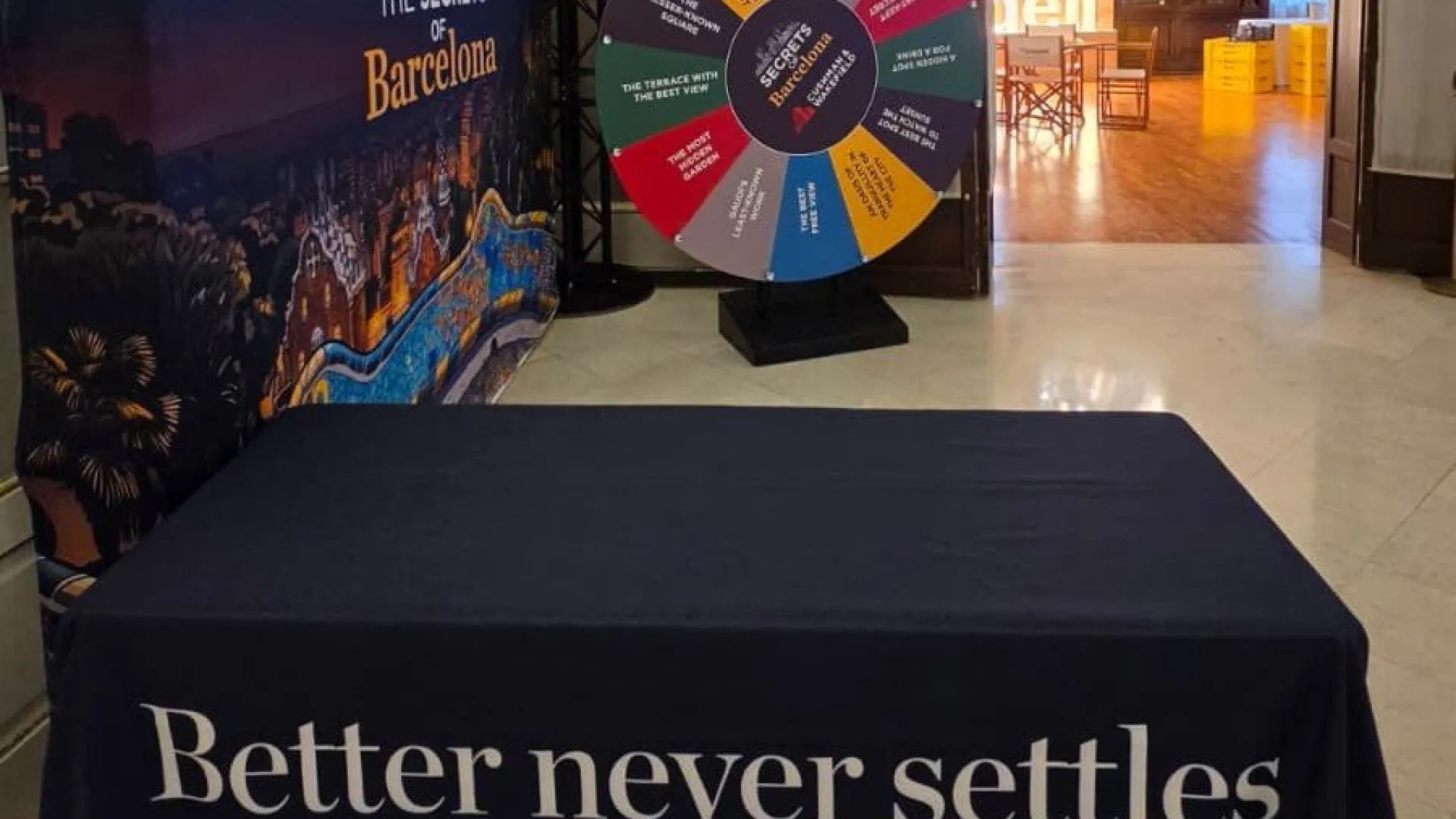 Giant wheel with a table and Barcelona backdrop in a hotel