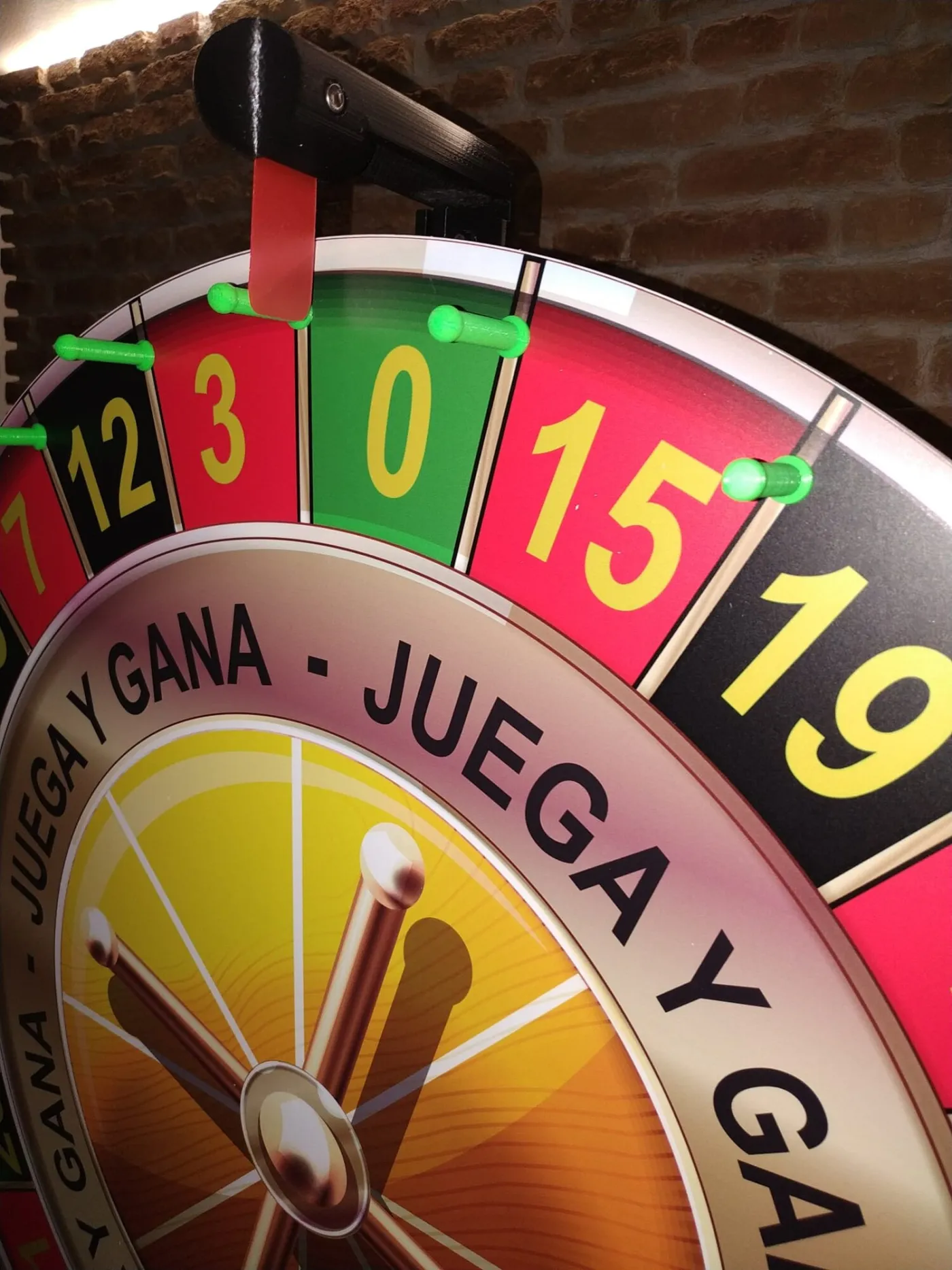 Close-up of a small "play and win" numbered wheel