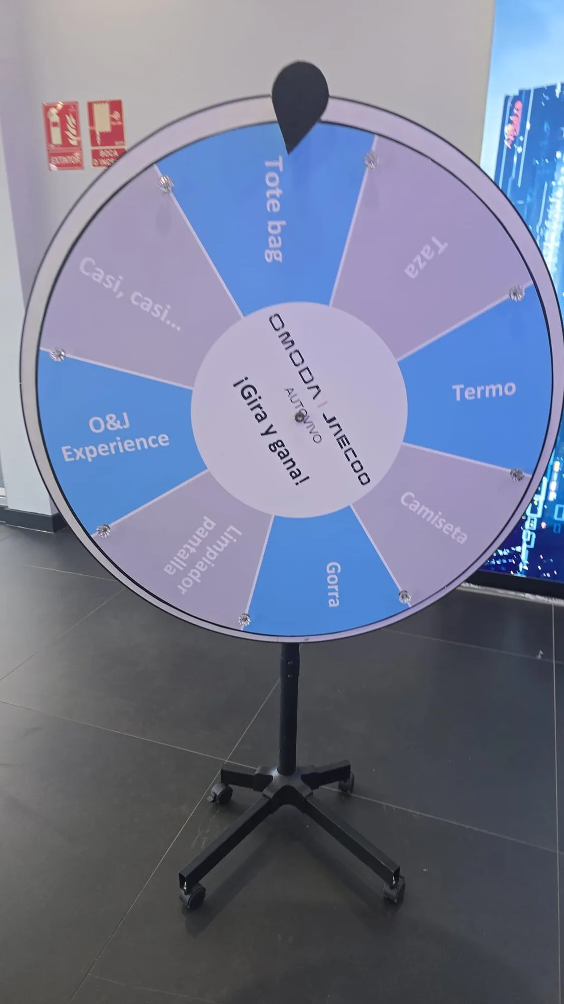 Blue promotional wheel on a stand